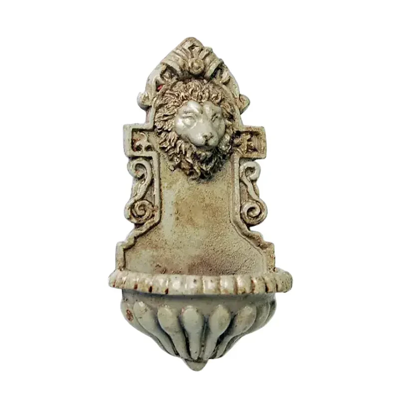 Fontaine murale tête de lion